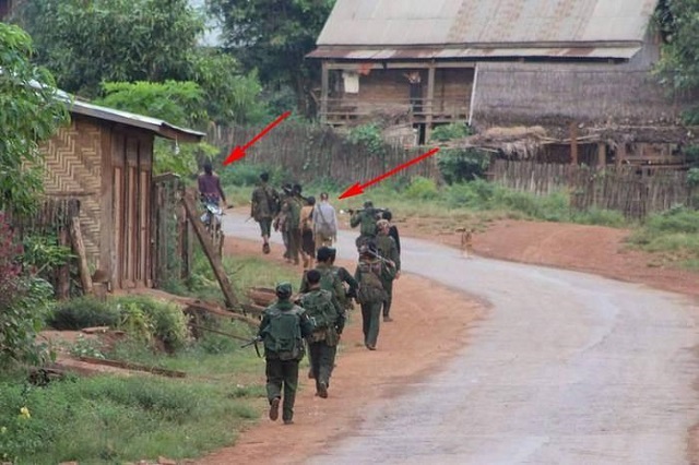 Villagers made to walk between Burma Army soldiers to prevent attack