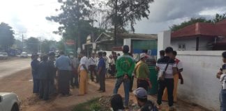 Burma Army Soldiers Plant Trees on Confiscated Farmland in Namzang Namzang farmers at township office