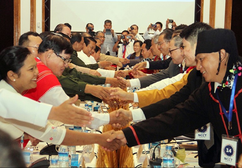 So called peace negotiators shake hands