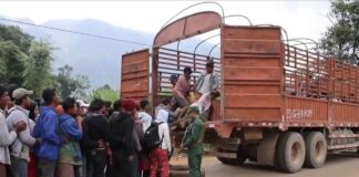 A Thrilling Journey from Laukkai to the Safe Place to Call Home People line up to get on the truck