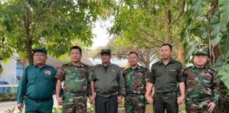 TLNA and SSPP Leaders Convene at UWSA Headquarters to Resolve Disputes SSPP and TNLA leaders hold hands