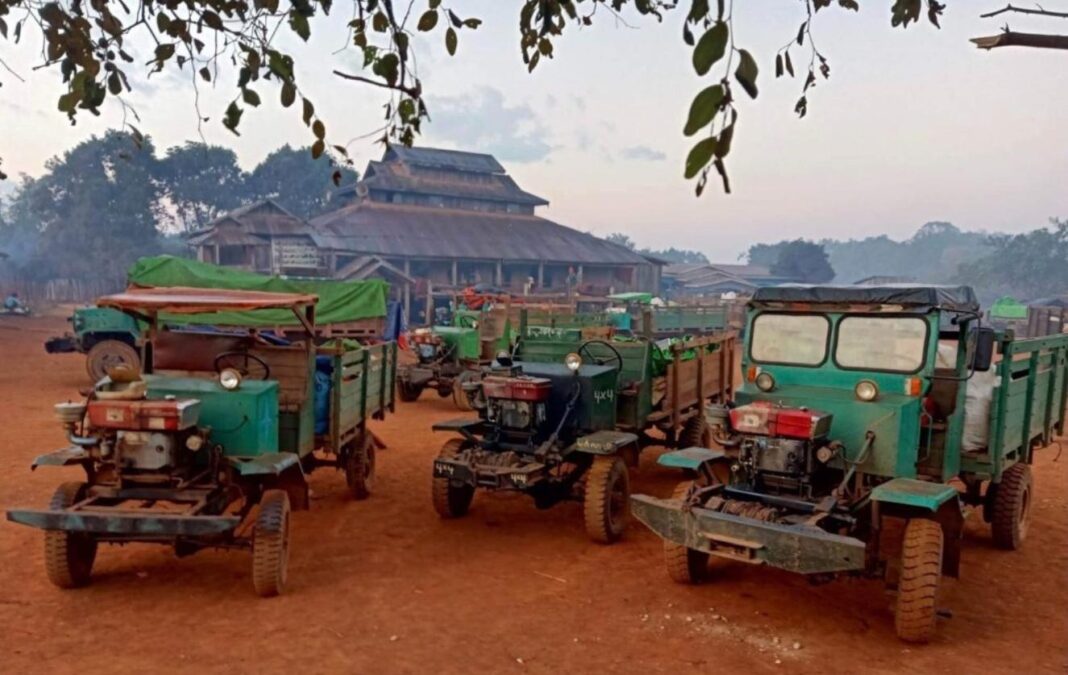Trucks parking at a temple in Lawksawk