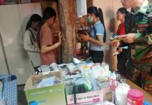 TNLA’s New Taxes on Pharmacies and Clinics in Namkham Spark Healthcare Crisis TNLA members collecting tax from clinic in Namkham