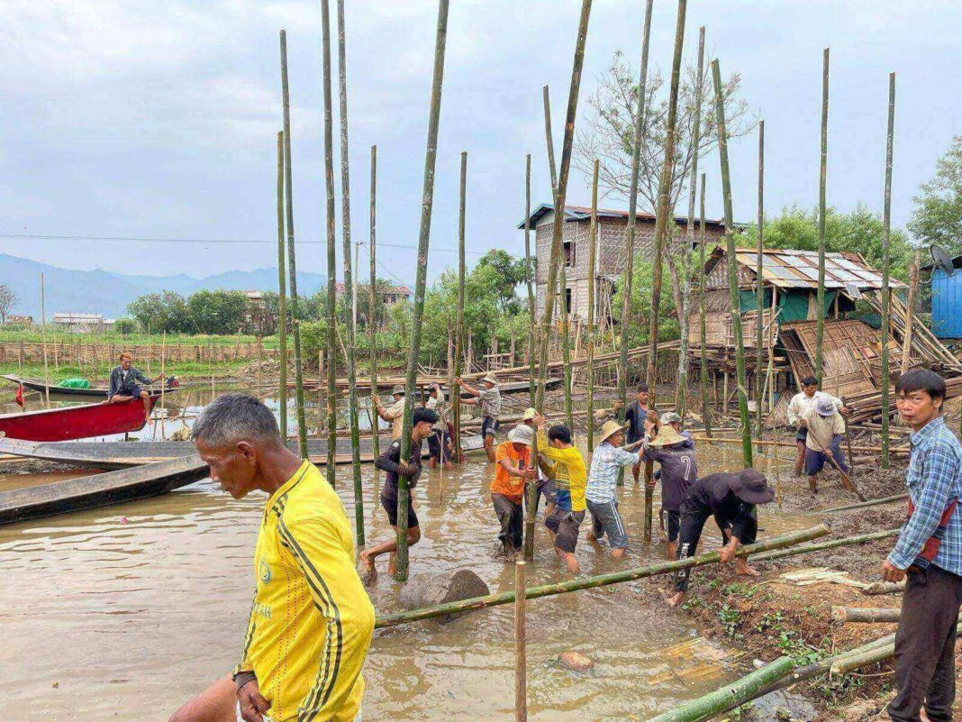 Villagers re building a house