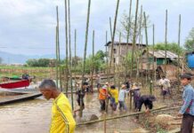 Inle Residents Struggle to Rebuild Amid Shifting Ground After Earthquake Villagers re building a house