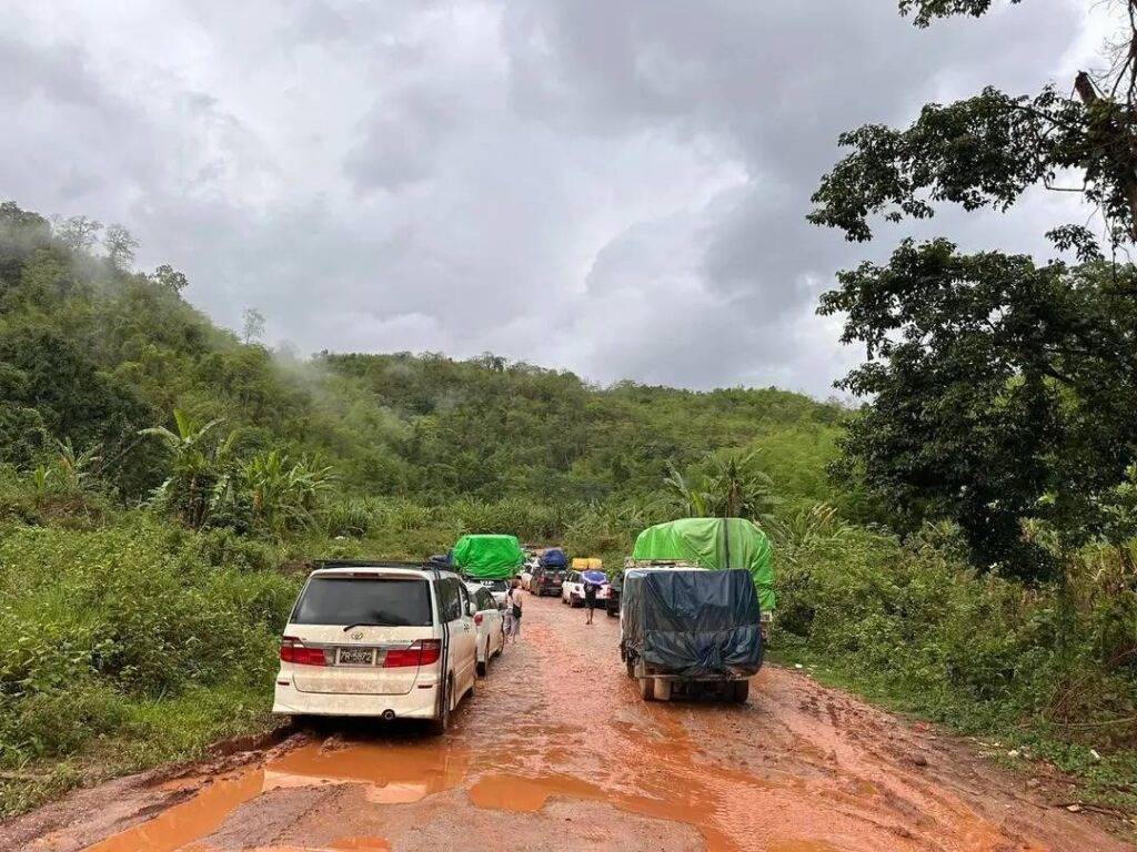 Vehicles on a muddy road in Shan State Vehicles on a muddy road in Shan State