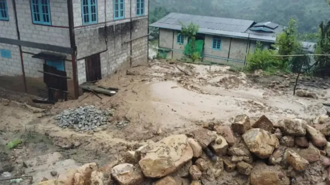 Floodwater brings mud and debris into Loimaw village houses