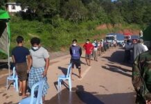 Woman Detained at Kalaw Checkpoint Over Alleged Links to Resistance Funding People line up at a checkpoint