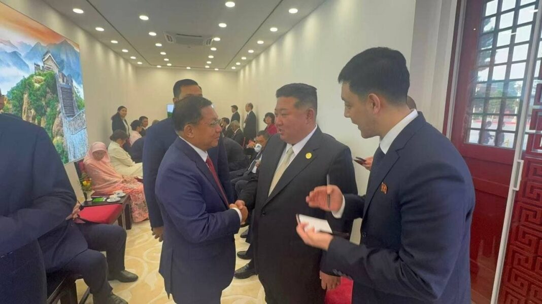 Min Aung Hlaing shakes hands with North Korean leader Kim Jong Un