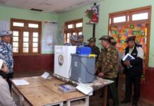 Regional Commander Accused of Pressuring Voters on Election Eve in Namsang Military personnel inspect a polling station ahead of voting in Namsang