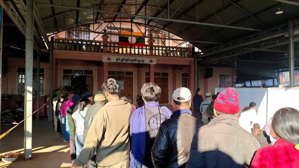 Residents are seen at a polling station set up by the military authorities