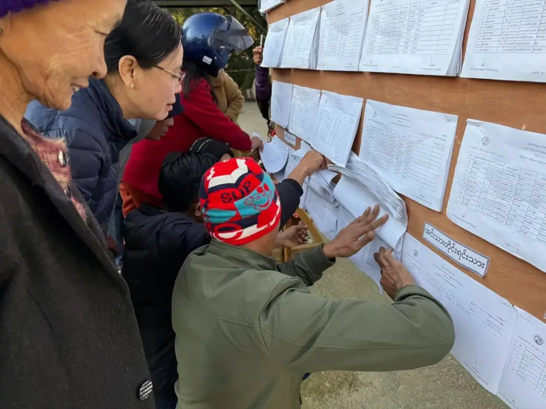 Residents check voter lists at a polling station in Northern Shan State
