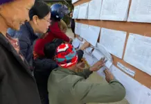 Low Voter Turnout Reported in Northern Shan State Amid Security Restrictions and Ongoing Conflict Residents check voter lists at a polling station in Northern Shan State
