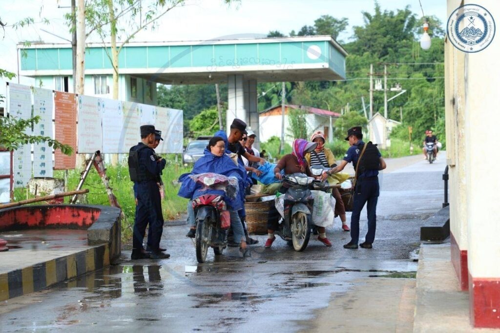 TNLA members inspect people at the entrance to Namkham