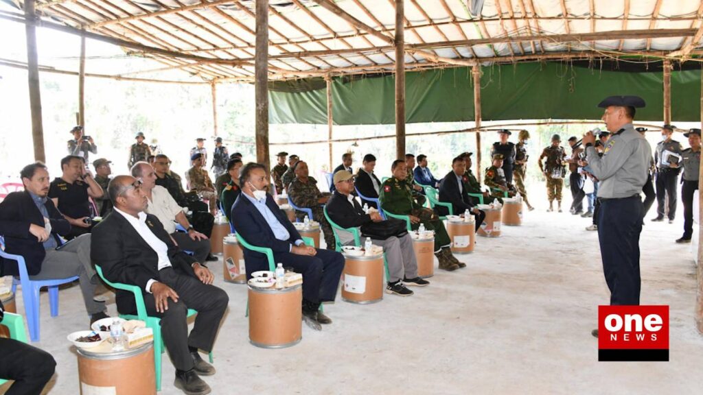 A military regime officer briefs foreign delegates