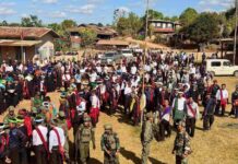 Fear of Extortion Looms as PNO Enters Kalaw Election Race PNO militiamen with civilians in southern Shan State