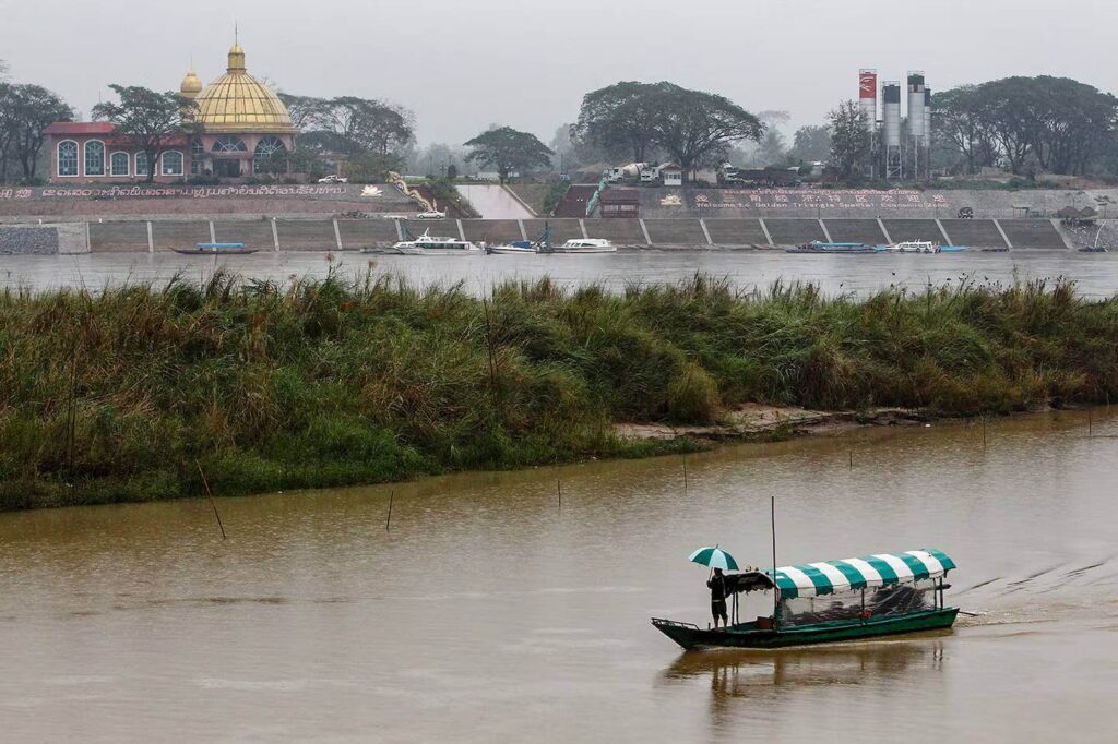 Boats crossing the Mekong River at the Golden Triangle border area