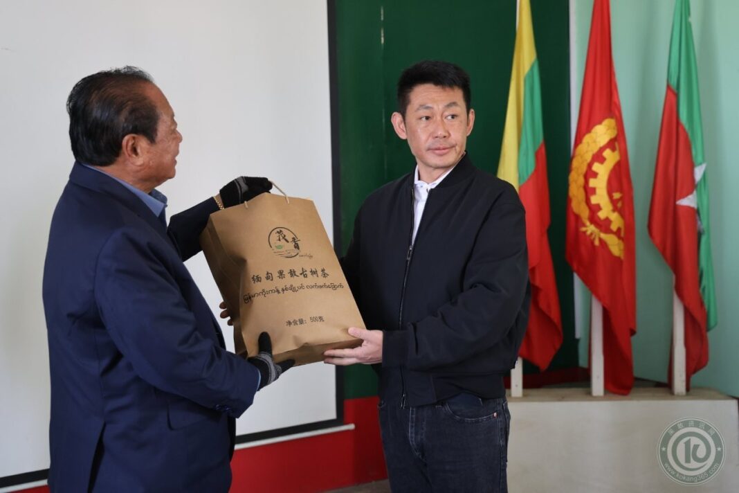 SSPPSSA Chairman Sao Pang Pha receives a ceremonial gift from an MNDAA representative SSPPSSA Chairman Sao Pang Pha receives a ceremonial gift from an MNDAA representative