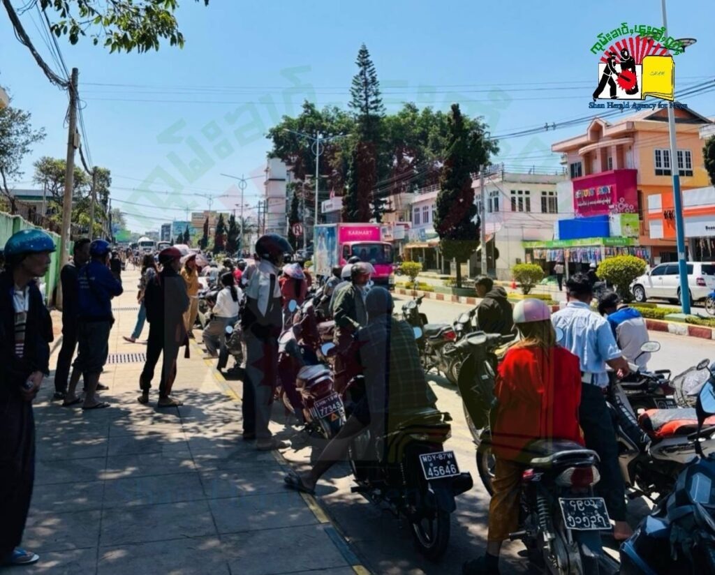 People line up at a petrol station amid fuel shortages People line up at a petrol station amid fuel shortages