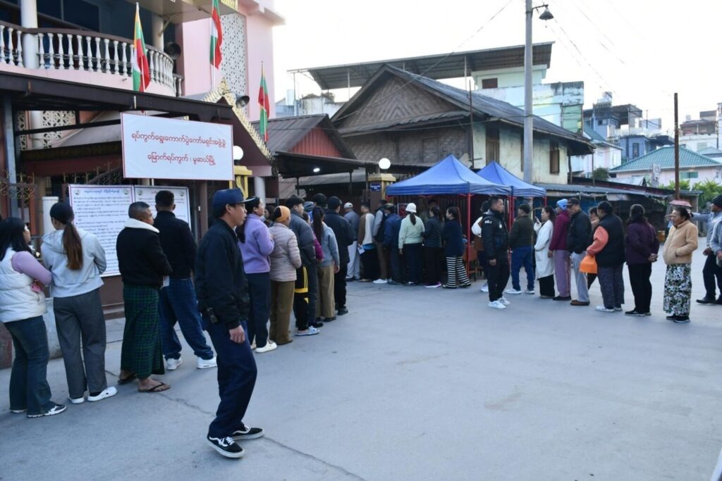 People line up to cast their votes at a polling station during Myanmar’s election