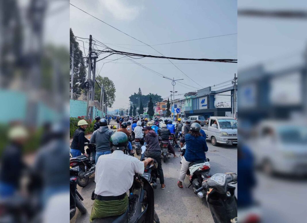 People queue at a petrol station in Taunggyi amid fuel shortages