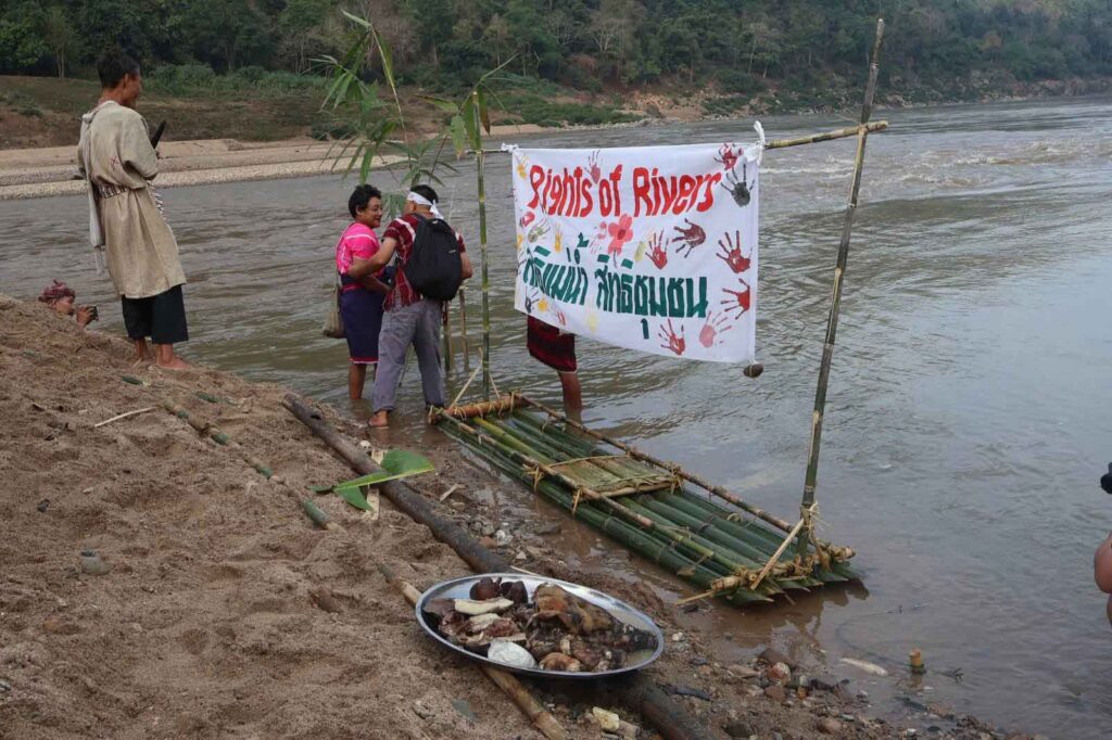 People stand by the Salween River, a lifeline that sustains both culture and livelihood