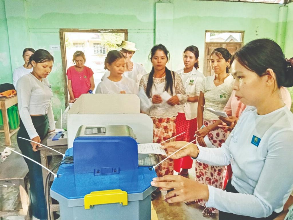 The voting process at a polling station during Myanmar’s election