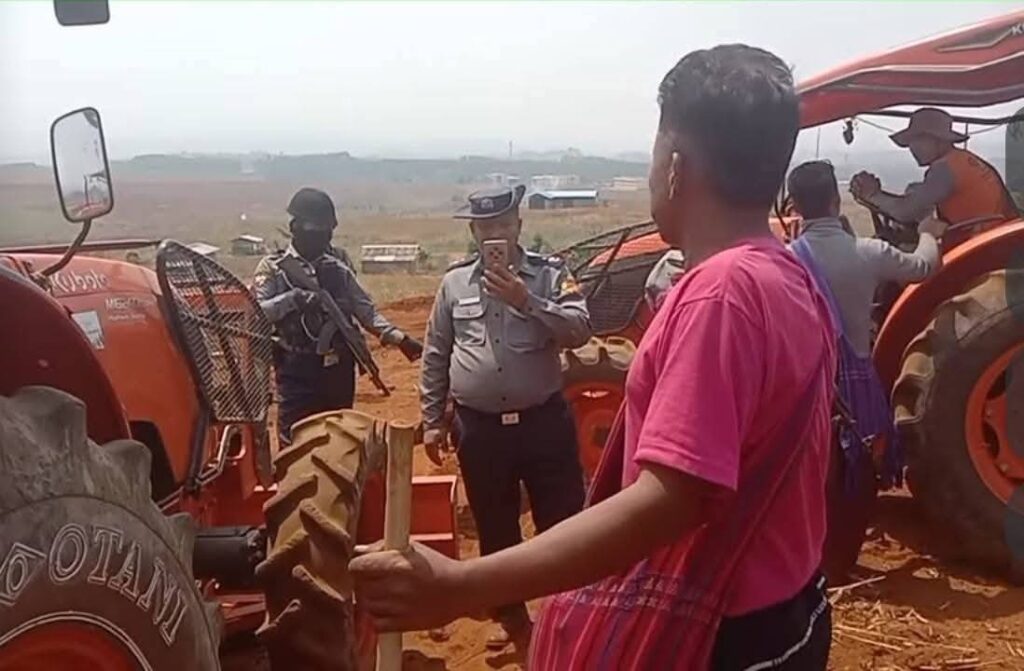 Civilians confront authorities during a land protest in Hopong