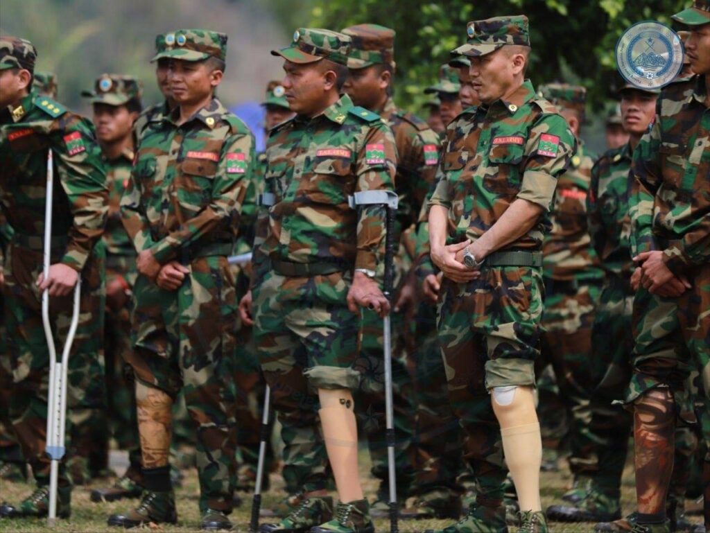 Ta'ang National Liberation Army troops who lost their limbs during the conflict attend a gathering