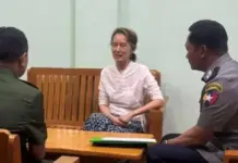 THE GILDED CAGE: Min Aung Hlaing’s Calculated Move on Aung San Suu Kyi Aung San Suu Kyi appears in a photo released by state media
