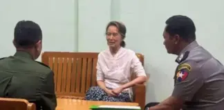 THE GILDED CAGE: Min Aung Hlaing’s Calculated Move on Aung San Suu Kyi Aung San Suu Kyi appears in a photo released by state media