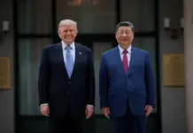 THE ROSE GARDEN TRUCE: How Trump and Xi Bought Time, Not Peace Donald Trump and Xi Jinping pose for a photograph during the visit