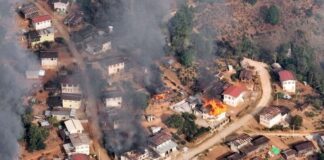 Displaced Villagers Return to Destroyed Homes in Southern Shan State Nanneint Village in Panglaung Township burns during clashes in March 2023