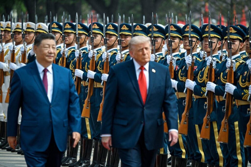 Xi Jinping and Donald Trump inspect an honor guard during an official visit to China