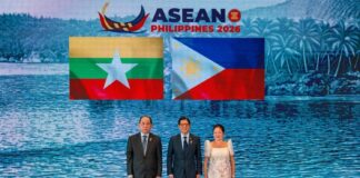 THE ASEAN’S 5PC IMPASSE: Why Benchmarks and Benchmarks Alone Cannot Force Compliance Myanmar's Permanent Secretary to ASEAN poses for a photo with Philippine President Ferdinand Marcos Jr and First Lady Louise Araneta Marcos during the ASEAN Summit in the Philippines