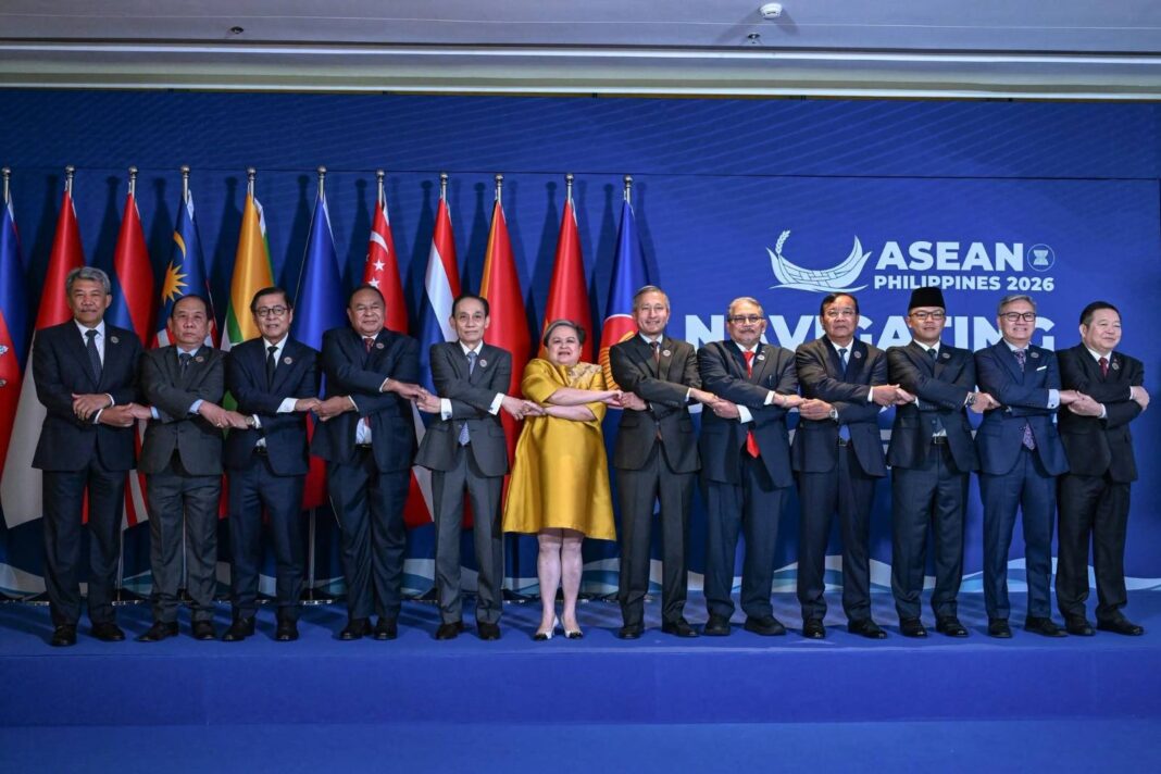 Philippine Foreign Minister Maria Teresa Lazaro joins fellow ASEAN leaders in the traditional ASEAN hand holding