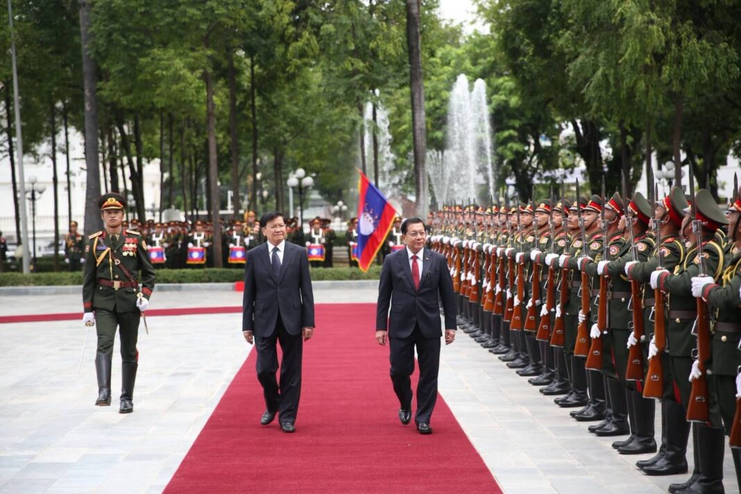 President Thongloun Sisoulith (left) welcomes Myanmar junta chief Min Aung Hlaing during his visit to Laos Photo Vientiane Times