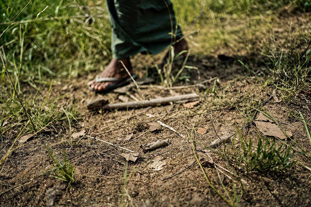 A man walks near an anti personnel mine Photo Sean Sutton A man walks near an anti personnel mine Photo Sean Sutton