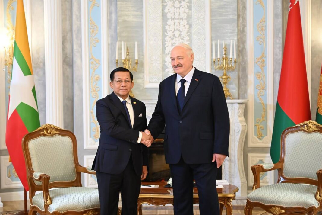 Myanmar junta chief Min Aung Hlaing shakes hands with Belarusian President Alexander Lukashenko during his visit to Belarus