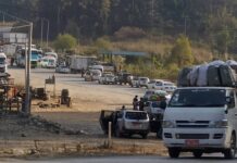 Trade Restrictions, Cargo Seizures Continue After Junta’s 100-Day Plan Ends Vehicles queue along a road amid cargo inspections and checkpoints